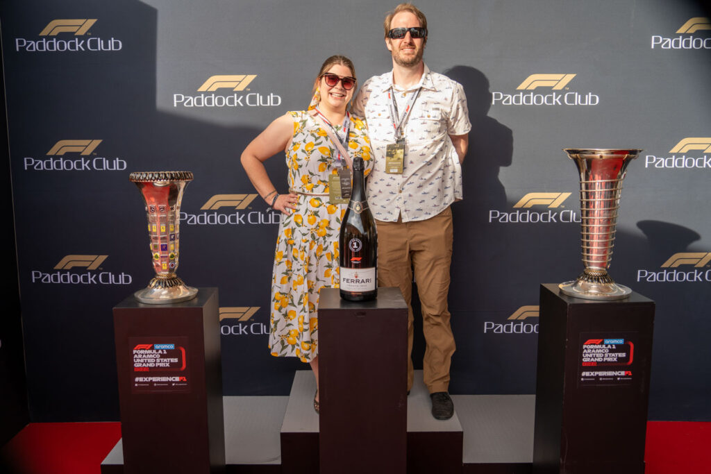 Amanda and Elliot with F1 trophies